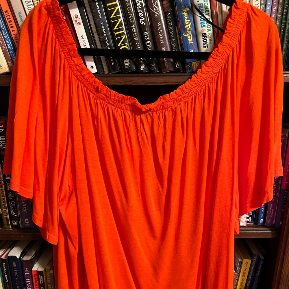 Nice flowing orange top by H&M. New with tags